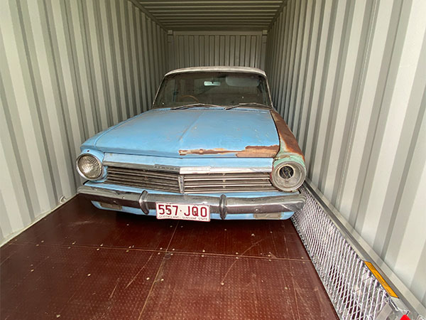 classic car being stored inside of a 20ft storage container