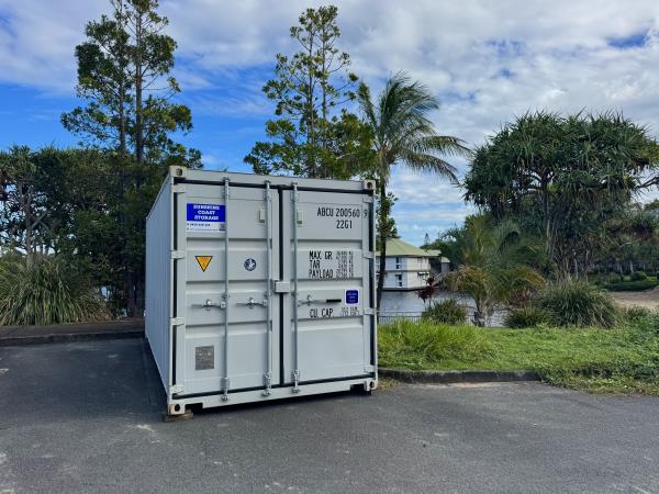 blue shipping container stored offsite on private property