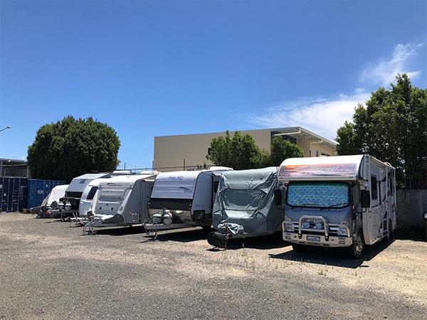 row of motorhomes, caravans and boats in storage at north brisbane storage