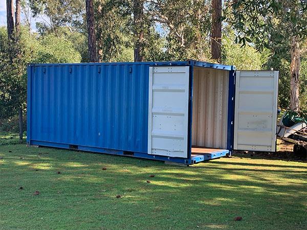 blue shipping container stored offsite on private property