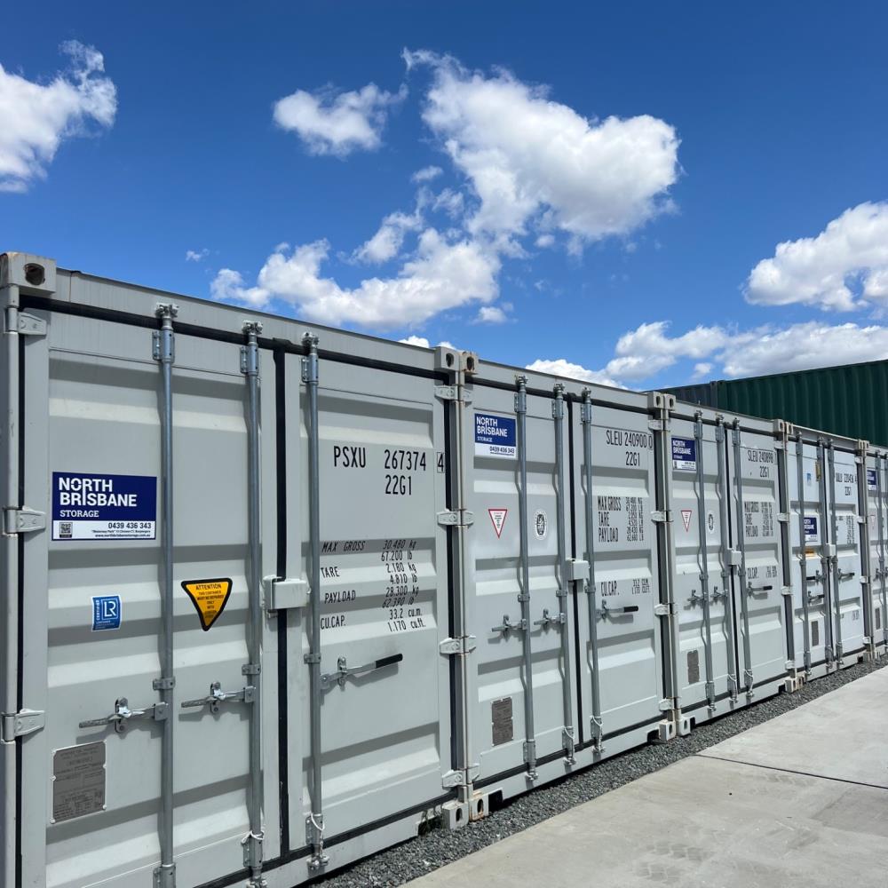 blue storage container unloading from removal vehicle